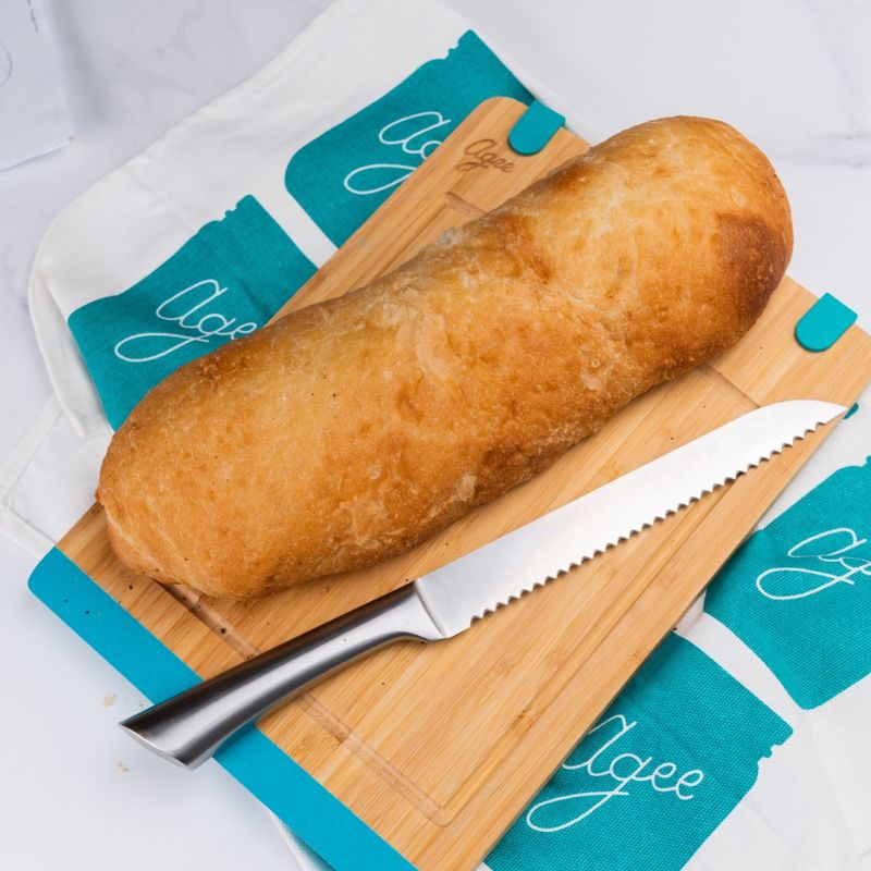 Agee jar print tea towel on bench with loaf of bread and knife