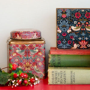 Arts & Crafts William Morris Red Strawberry Thief Tea Caddy shown styled with the other strawberry thief tins.