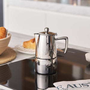 Avanti Art Deco Espresso Maker 100 ml shown on a kitchen bench top next to bread and a tea towel.
