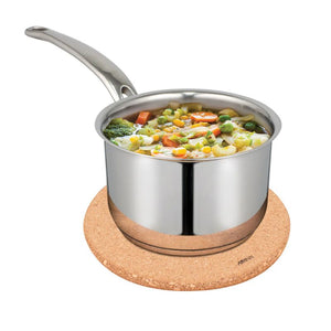 Stainless steel saucepan with vegetable soup on a Avanti Round Cork Trivet against a white background