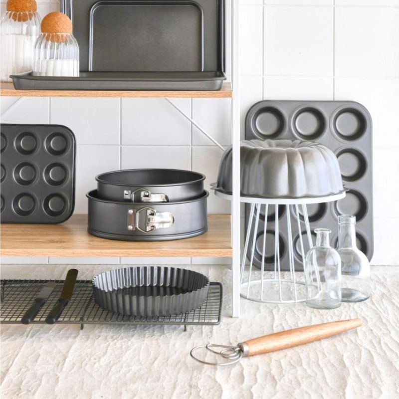 Bakemaster Dough Whisk with a wooden handle on a white background