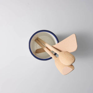 Bakemaster Enamel Utensil Holder holding a set of wooden utensils including a spoon, spatula, and ladle on a white background