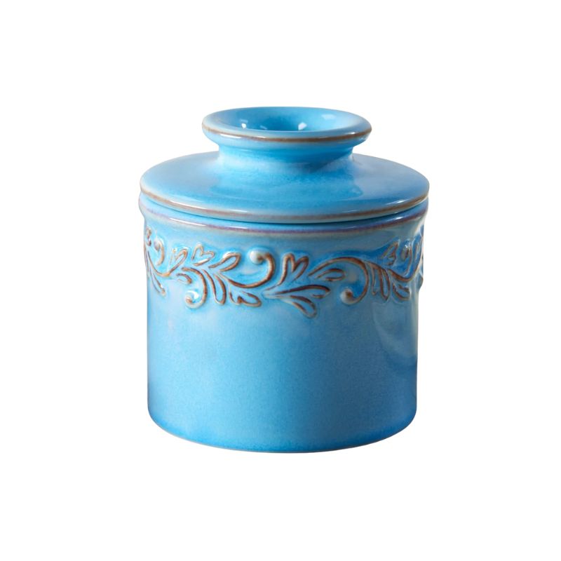 Front view of the Bleu Clair Butter Bell Crock in light blue with embossed vine detailing and a glossy finish