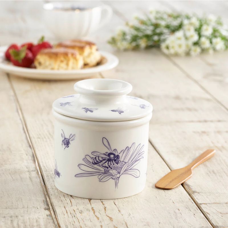 Front view of the Honey Bee Butter Bell Crock with navy bee illustrations on a white ceramic background - NZ