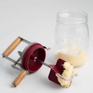 Freshly churned butter being removed from the Kilner Butter Churner paddle