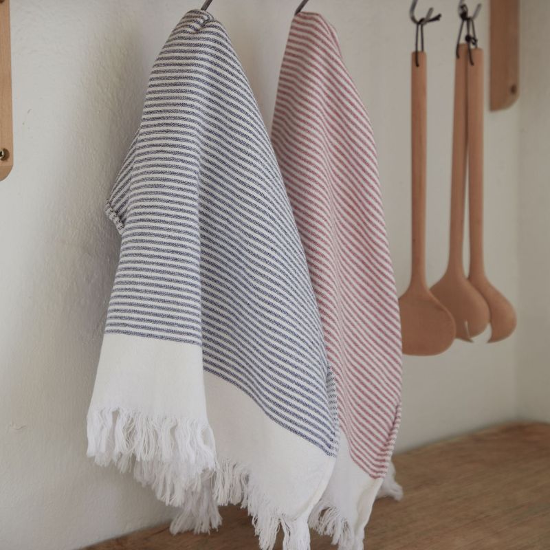 Casafina Terry Stripe Kitchen Towel in Red hanging from a hook on a white background
