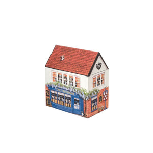 Dana Kubrick Tea Shop Tin showing a English village inspired tea house with draping wisteria and removable roof.