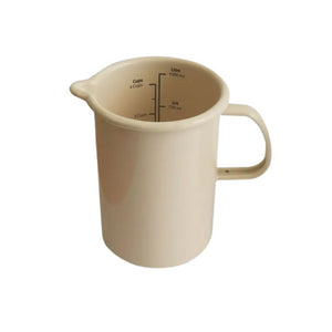 Dishy Enamel Measuring Jug in Almond shown front on against a white background.