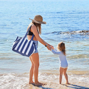 The Dock & Bay Foldaway Tote Bay - Whitsunday Blue being used as a beach bag | NZ