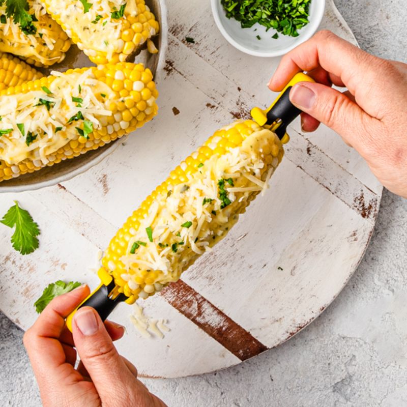 Dreamfarm Lockorns corn cob holders showing corn held securely from both ends by two holders