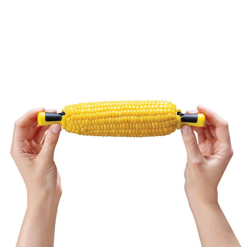Dreamfarm Lockorns corn cob holders showing corn held securely from both ends by two holders