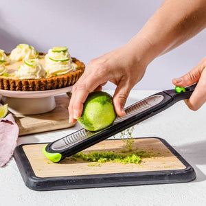 Dreamfarm Ozest - Fine Zester in use zesting limes | NZ