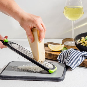 Dreamfarm Ozest - Fine Zester being used to finely grate a hard parmesan cheese | Microplane NZ