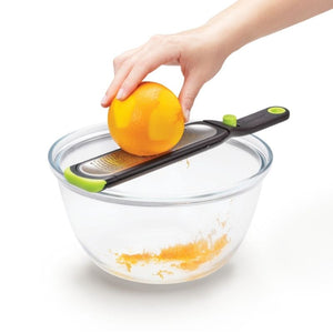 Dreamfarm Ozest - Fine Zester being used to zest an orange | NZ