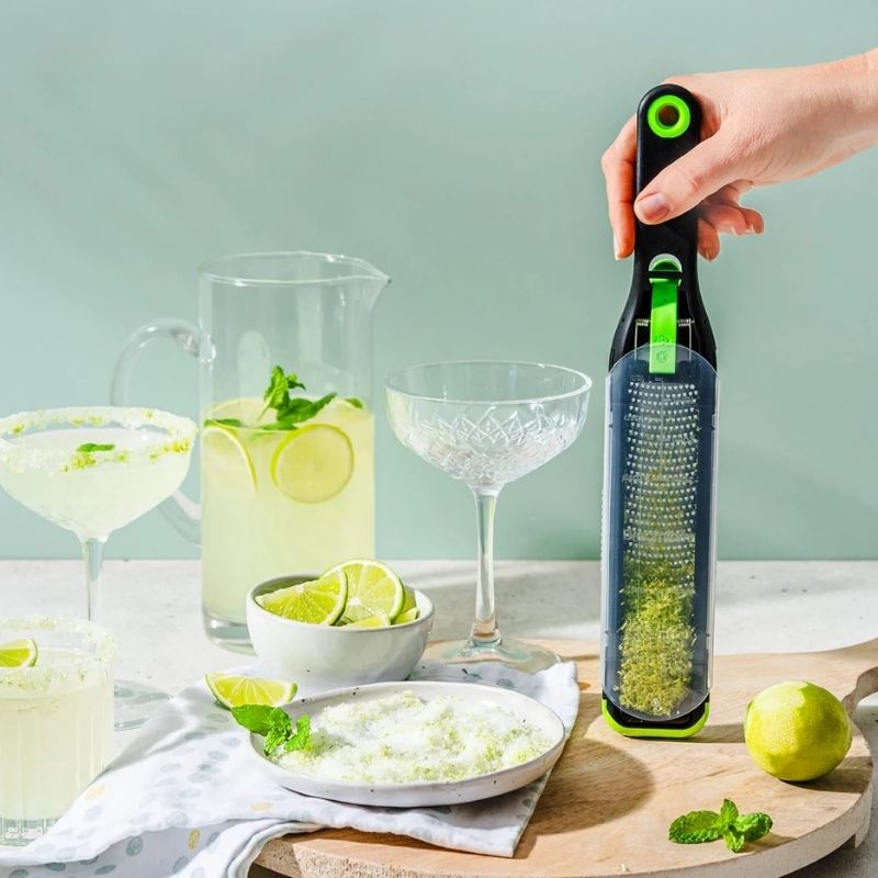 The sleeve being used on the Dreamfarm Ozest - Fine Zester while zesting limes for cocktails | NZ