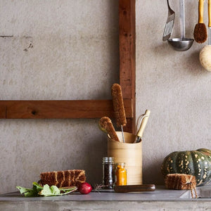Kitchen bench top with a collection of Eco Max brushes