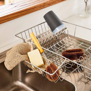 Kitchen sink with a dish rack holding the Eco Max Dish Brush and Scrubber