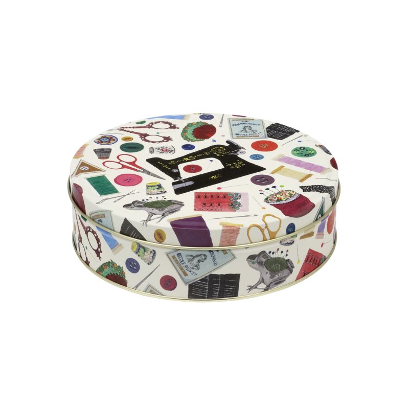 Elite Tins Needle & Thread Medium Round Tin with vintage sewing machine and classic sewing notion print.