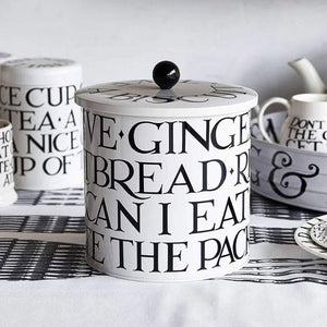 The Emma Bridgewater Black Toast Biscuit Barrel with other items from the Black Toast range in the background