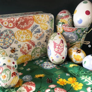 The Emma Bridgewater Easter Egg Hunt Deep Rectangular Tin styled with the coordinating bucket and decorative tin eggs.