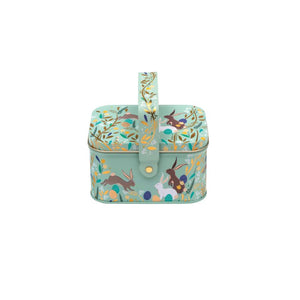 Sara Miller Happy Bunnies Easter Handle Basket, illustrated with rabbits, flowers and pastel eggs on a soft blue background.