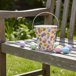 Emma Bridgewater Mini Egg Easter Hunt Bucket styled outside with Easter eggs.