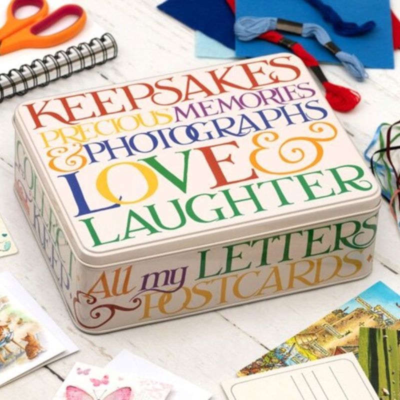Emma Bridgewater Rainbow Toast XL Storage Tin with multicoloured phrases on the lid and sides.