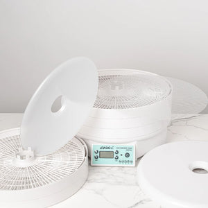 Ezidri FD500 Digital Dehydrator disassembled - showing trays, solid and mesh sheets, and removable lid