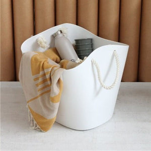 The white Hachiman Balcolore Storage Basket (19 L) being used as a picnic basket