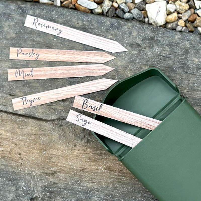 Close up of the pocket from the Hachiman Garden Tool Bag being used to hold name tags for a herb garden