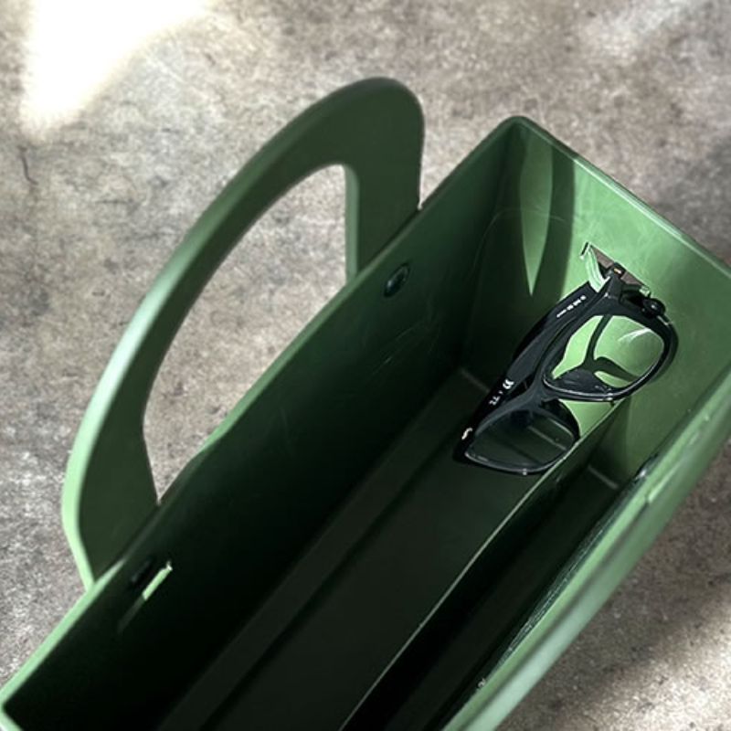 Loop on the Hachiman Garden Tool Bag with Pocket being used to hold glasses - the internal divider of the bag shown