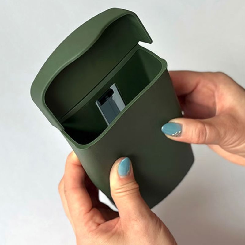 Hands holding the pocket from the Hachiman Garden Tool Bag