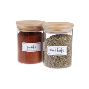 Paprika and mixed herbs in glass spice jars with the Appetito Herb & Spice Labels.