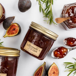 Jars of homemade fig jam with figs and rosemary - Kilner 200mL Wide Mouth Preserve Jar shown.