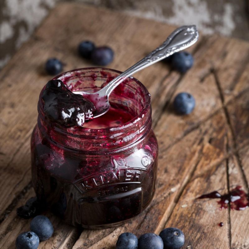 Blueberry jam in a 250mL Kilner Genuine Preserve Jar with spoon resting on top of jar - traditional farmhouse kitchen NZ