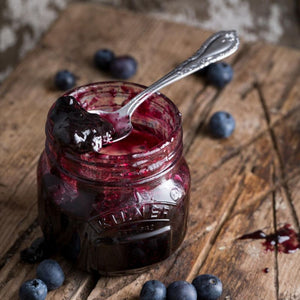 Blueberry jam in a 250mL Kilner Genuine Preserve Jar with spoon resting on top of jar - traditional farmhouse kitchen NZ