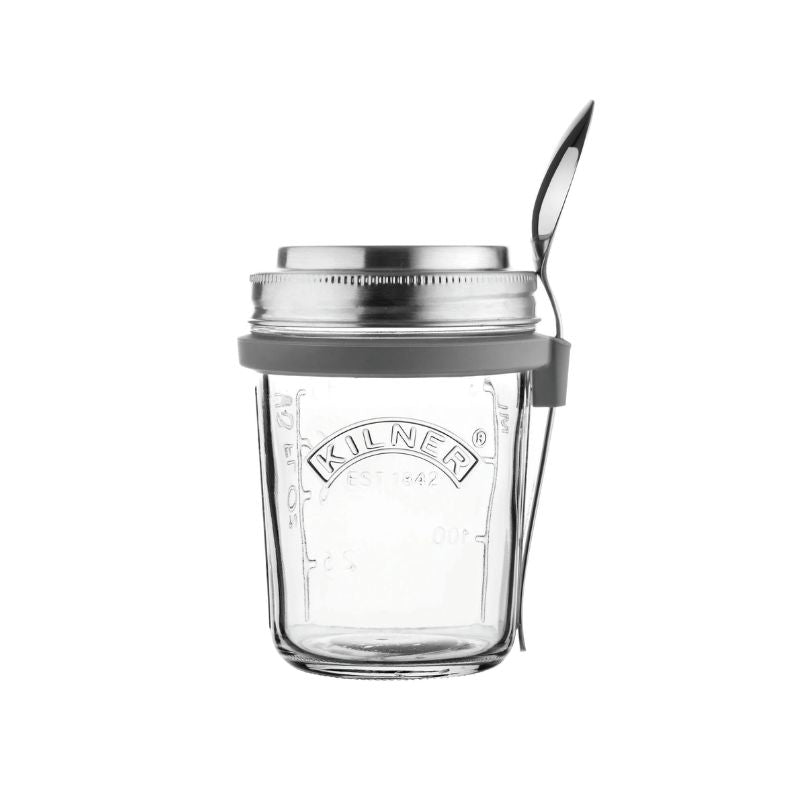 Kilner 350 mL Breakfast Jar with stainless steel lid, silicone band, and spoon attached.