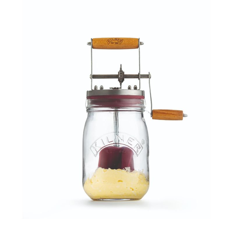 Kilner Glass Butter Churner filled with churned cream, showing the butter starting to form