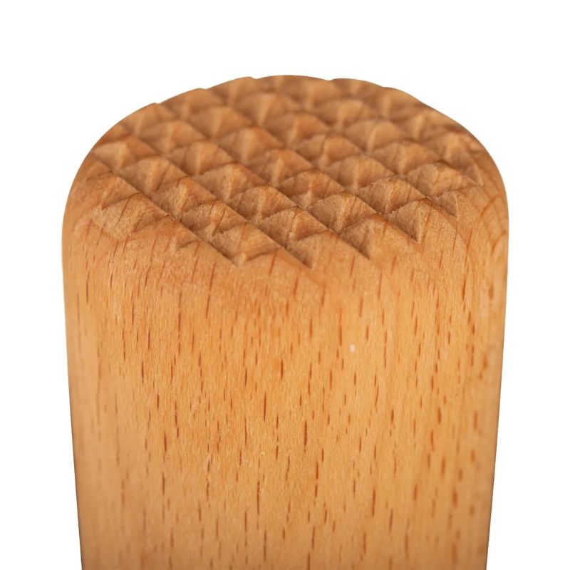 Close-up of the textured wooden head of the Kilner Fermentation Packer, designed to break down vegetables and release juices.
