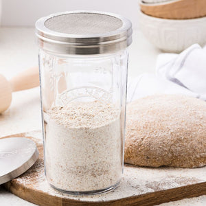 Kilner Glass Sifter Jar filled with flour, shown with stainless steel sifter lid.