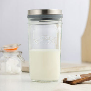 Kilner Kefir Set featuring a glass jar with metal lid filled with kefir milk on a white surface