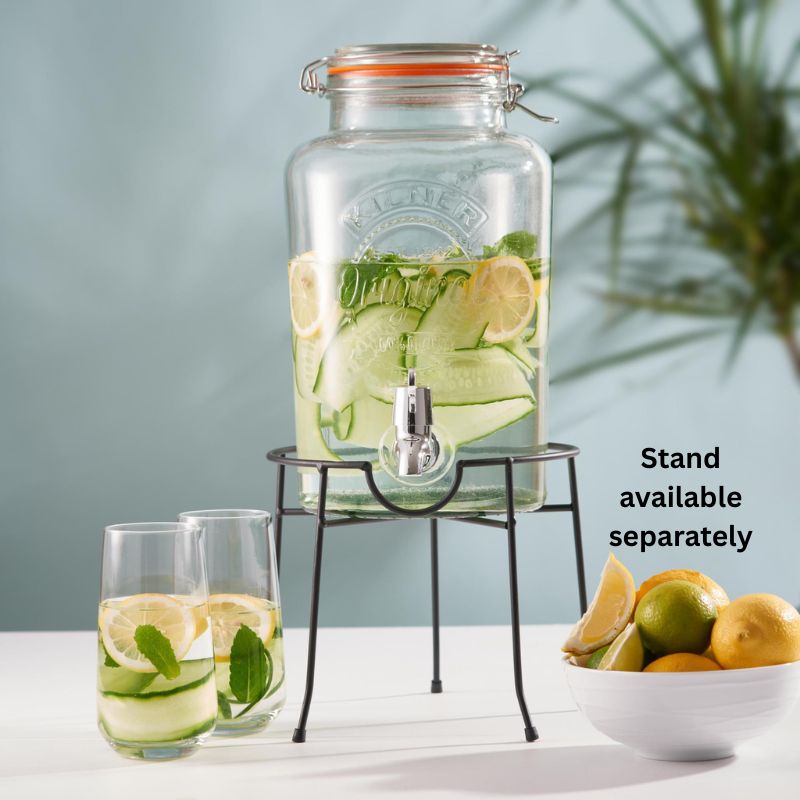 Kilner 5L Round Clip Top Drinks Dispenser filled with lemon , cucumber ribbons, mint and water - displayed on the drink dispenser stand.
