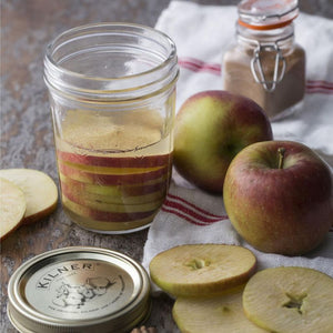 Kilner 350 mL Wide Mouth Preserve Jar filled with apple slices in a rustic country kitchen NZ
