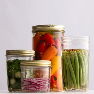 KIlner Wide Mouth Preserve Jars in various sizes shown filled with vegetables.