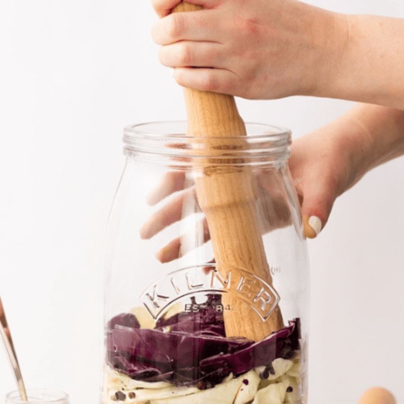 Kilner Fermentation Packer made from FSC beech wood with Kilner logo, designed for pressing vegetables in jars.