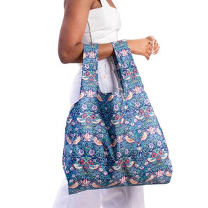 Woman carrying Kind Bag Reusable Shopping Bag in the William Morris Strawberry Thief print | NZ