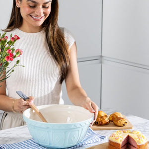 Woman using the Mason Cash Powder Blue Colour Mixing Bowl (29 cm).