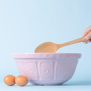 Mason Cash Powder Pink Colour Mixing Bowl (29 cm) styled with eggs on a blue background.