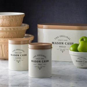 Mason Cash Heritage tea and coffee canisters with matching bread bin and mixing bowls in the background.