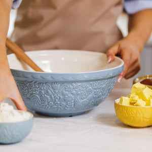 Mason Cash Home To Roost Hen Mixing Bowl in Blue (26cm) being used alongside matching prep bowls.